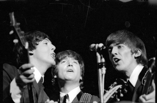 The Beatles on stage 1964 Paul McCartney John Lennon and George Harrison 