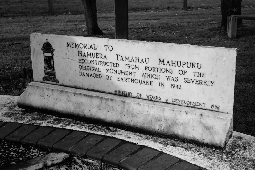 Marble plaque with text on it built into ground.