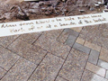 Detail of paving with inlaid text Mau tena kiwai o te kete, maku tenei Each of us at a handle of the basket.